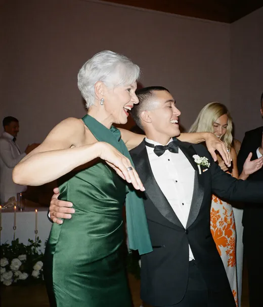 Two older guests dancing at a wedding reception